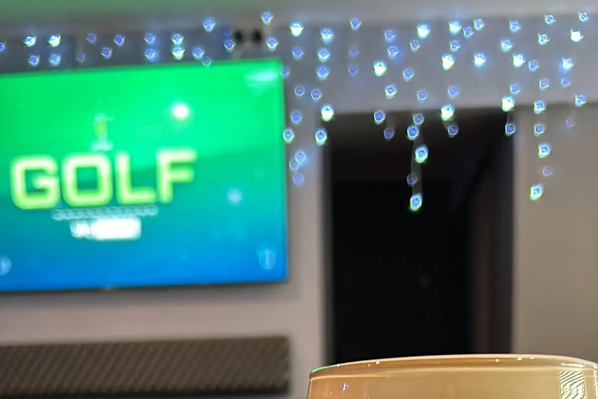 A pint of Guinness at The Castle Inn with sports on the big screen