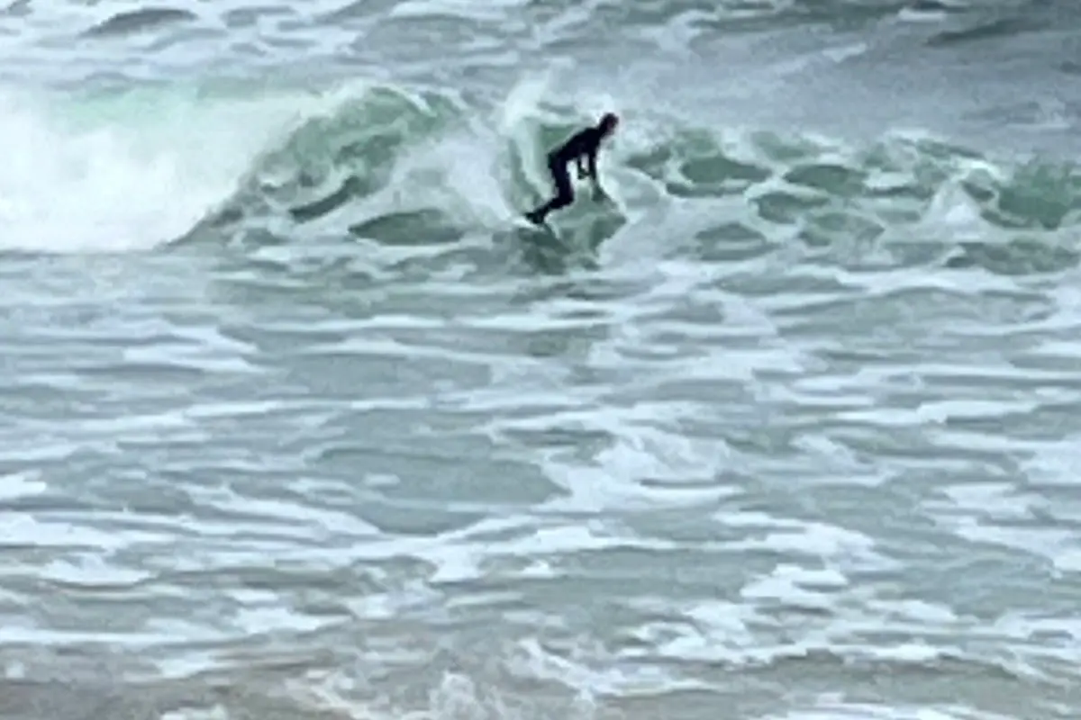 Surfer riding a wave at Easkey, one of Ireland's top surf spots